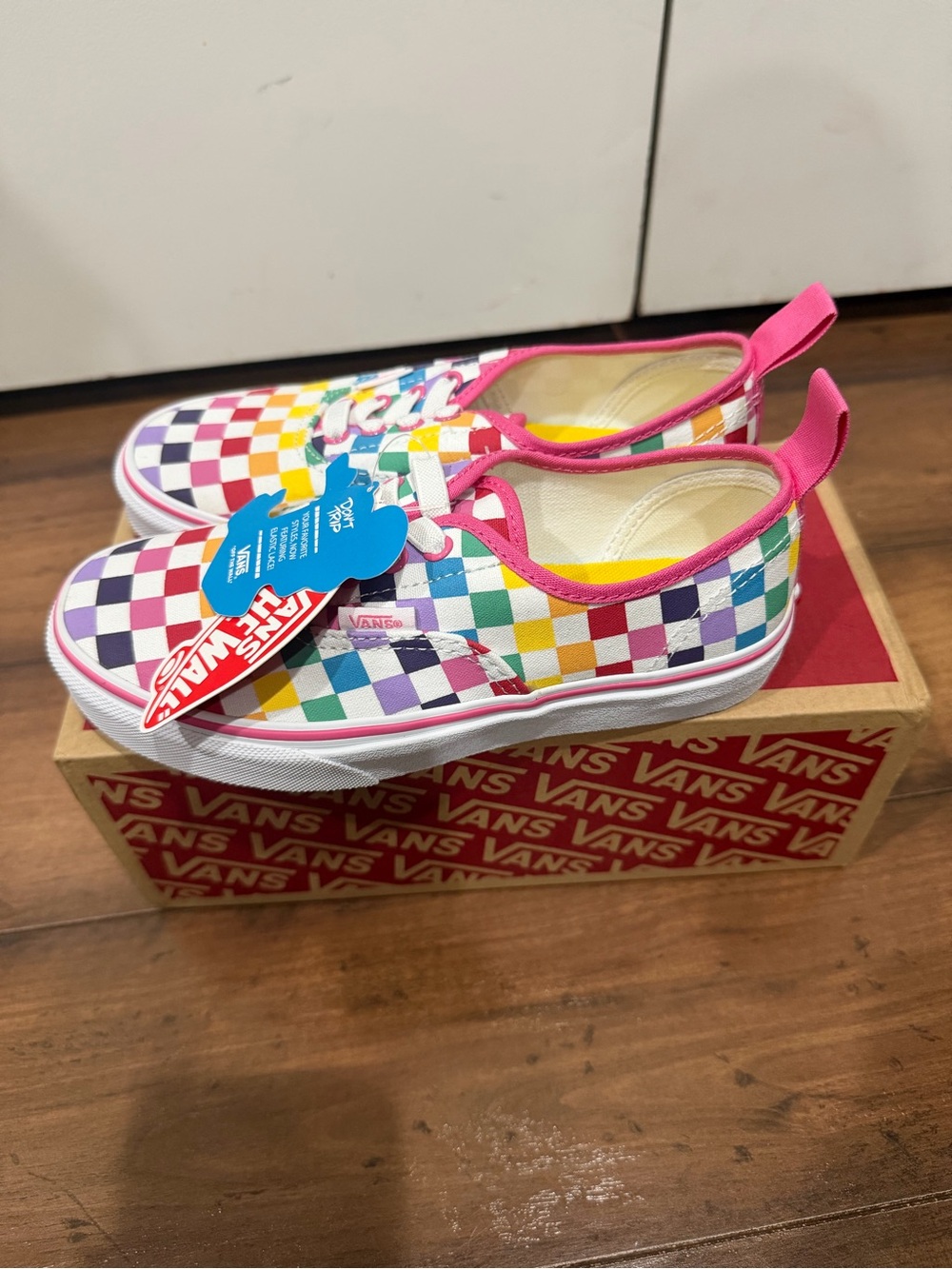 Vans Kids Rainbow Checkerboard Slip-On with Pink Trim